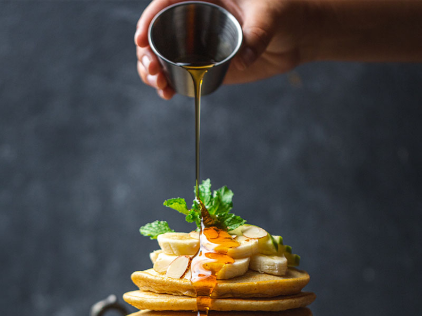 Pancakes with bananas and maple syrup